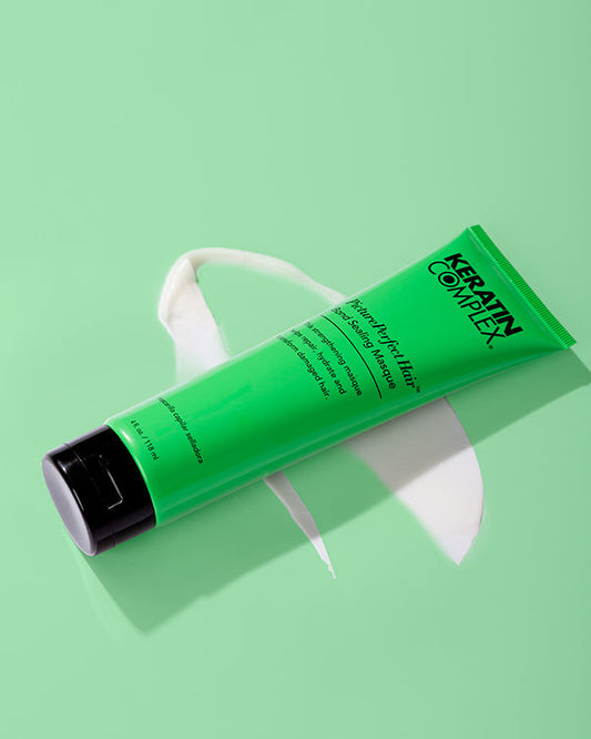 Green PicturePerfect hair masque bottle on green background