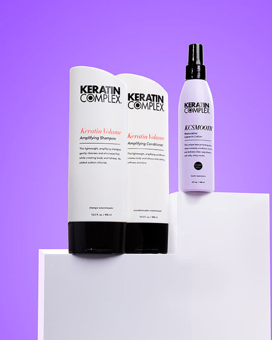 Keratin Volume Shampoo and Conditioner and KCSMOOTH Leave-In on a purple background