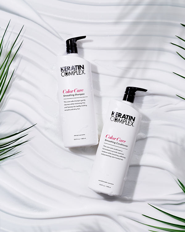 Colour Care Smoothing Shampoo and conditioner litre bottle on a white textured background 